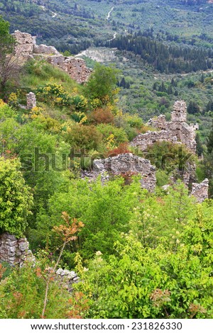 Old ruins of the Byzantine city of Mystras scattered on the hill side, Greece