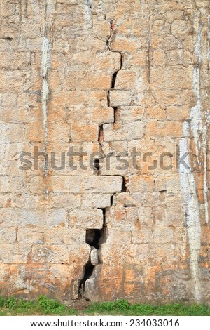 Long crack splits the foundation of a fortified wall inside Venetian old town of Trogir, Croatia
