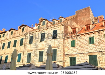 Green windows on a building with Venetian architecture inside the old town of Dubrovnik, Croatia