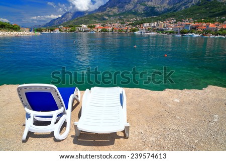 Couple of plastic beach chairs on the Dalmatian coast, Makarska, Croatia