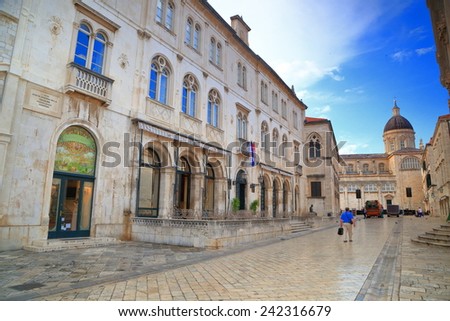Stone buildings and distant church dome with Venetian architecture inside the old town of Dubrovnik, Croatia