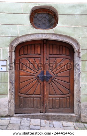 Old wooden door from medieval village of Cesky Krumlov, Czech Republic