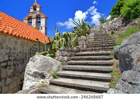Sunny steps climb near orthodox church in Mediterranean area, Montenegro