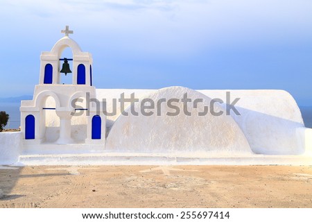 White and blue bell tower of traditional church on Santorini island, Greece