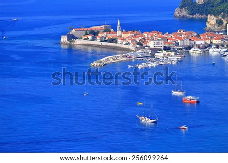 Blue water around Venetian old town surrounded by small boats on the Adriatic sea, Budva, Montenegro