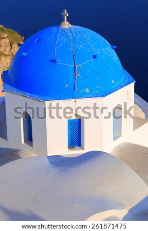 Traditional church covered with blue dome on the island of Santorini, Greece
