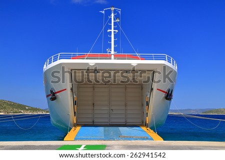 Open gate to large ferry boat in sunny day of summer, Agia Marina, Greece