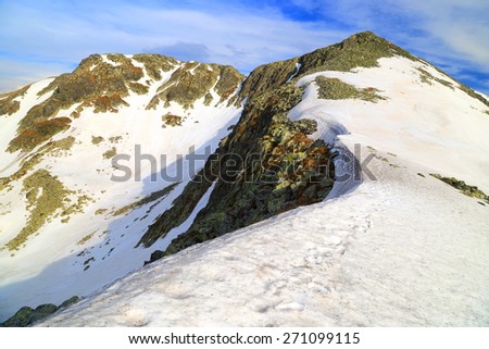 Mountains with snow leaving the summits uncovered in springtime