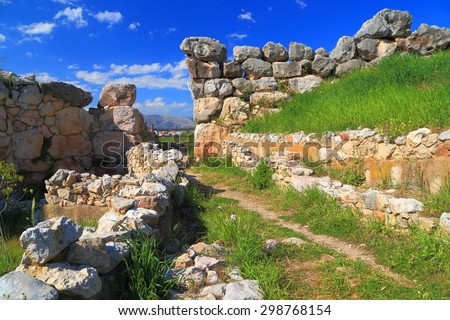 Ancient street surrounded by the ruined walls of Tyrns, Greece