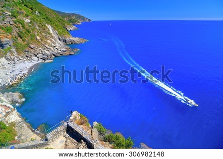 Power boat along Ligurian coastline near Vernazza, Cinque Terre, Italy