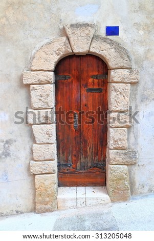 Wooden door to medieval house inside Roquebrune Cap Martin, French Riviera, France