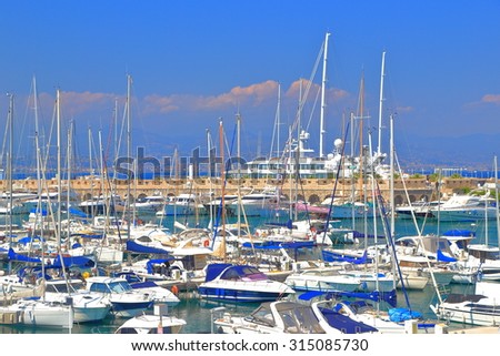 Sail and motor boats inside the harbor of Antibes, French Riviera, France