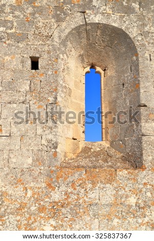 Old window opens in the walls of medieval fortress, Les Baux de Provence, Provence, France