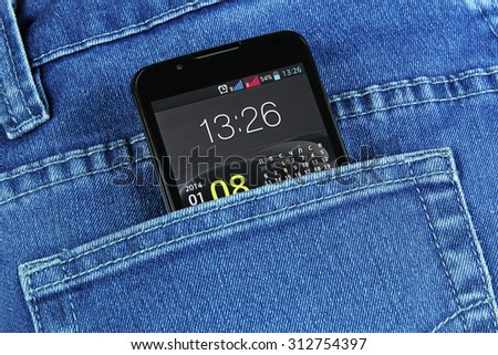 black phone in jeans pocket with the included screen closeup