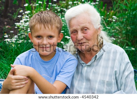 boy and grandmother in garden