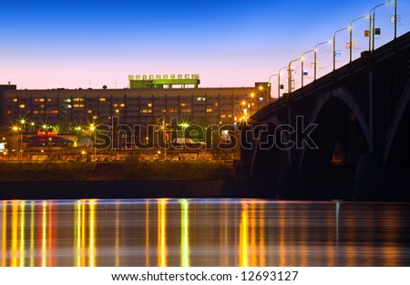 night city of Krasnoyarsk bridge over Yenisei river