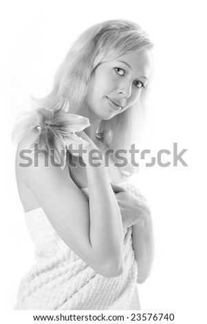 Beauty blonde spa girl with pink lily on white background