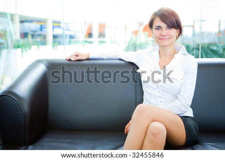 businesswoman head of business sit on skin sofa