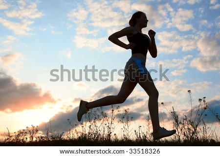 Silhouette woman run under blue sky with clouds and sun