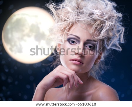 beauty woman  under moon in winter season