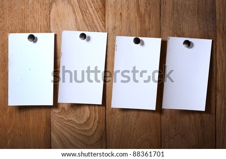 Photo paper attach nail wooden background