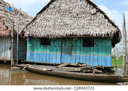 Houses on stilts rise above the polluted water in Belen, Iquitos, Peru. Thousands of people live here in extreme poverty without clean water or sanitation.