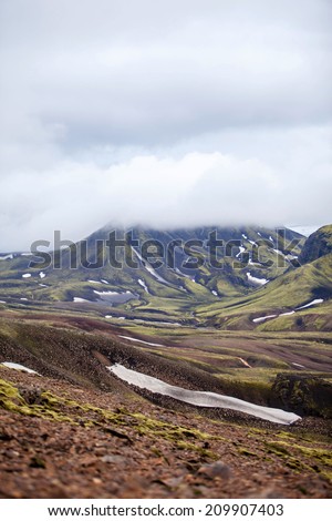 Volcanoes create a bizarre landscape of rhyolite rocks and green moss along the Landmannalaugar trek