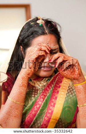 A young Indian bride crying