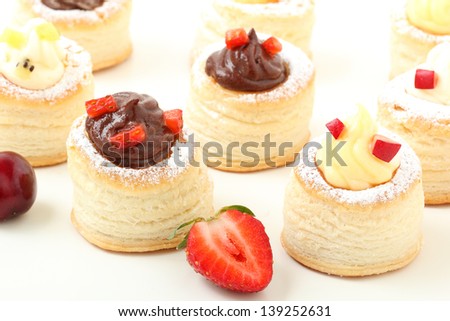 vol au vent sweet with cream and fruit on white background