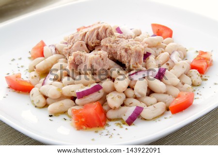 tuna salad with beans onion and tomato on plate