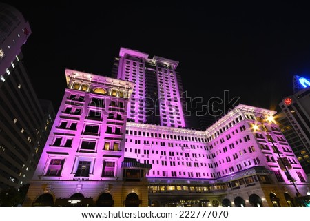HONG KONG- October 10,2014:The Peninsula lit pink . The Peninsula Hong Kong, located in Tsim Sha Tsui, Kowloon, Hong Kong, is the flagship property of the The Peninsula Hotels group.