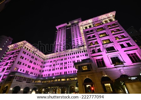 HONG KONG- October 10,2014:The Peninsula lit pink . The Peninsula Hong Kong, located in Tsim Sha Tsui, Kowloon, Hong Kong, is the flagship property of the The Peninsula Hotels group.