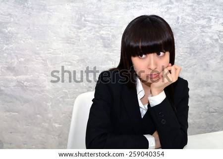 Business woman at the office in a bad mood