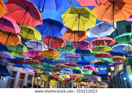NAGASAKI, JAPAN - July 28, 2015 :Umbrella road. Huis Ten Bosch is a theme park in Sasebo, Nagasaki, Japan, which recreates the Netherlands by displaying real size copies of old Dutch buildings.