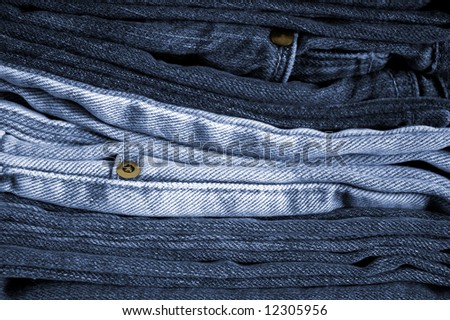 Close-up of a stack of folded blue jeans