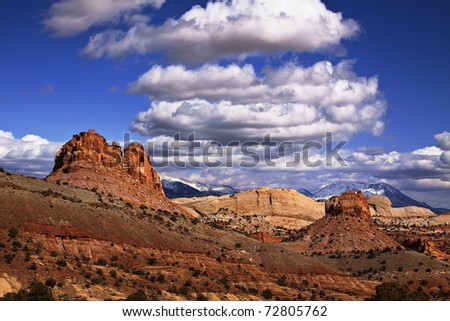 View of the red rock formations in Capitol Reef National Park with blue sky?s and clouds