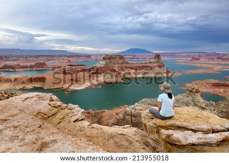 A woman enjoying the view from Alstrom Point, Lake Powell, Glen Canyon National Recreation Area.