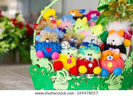 Stuffed animal toys in a basket.