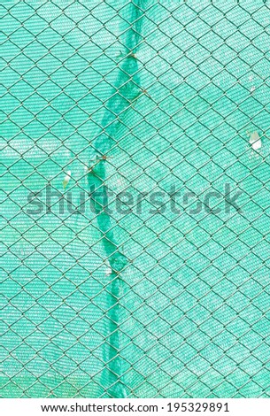 Wire Mesh Fence Close-Up  on the  light filtering mesh.