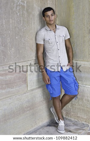 A young guy is standing in the corner of walls/Portrait of Young Guy