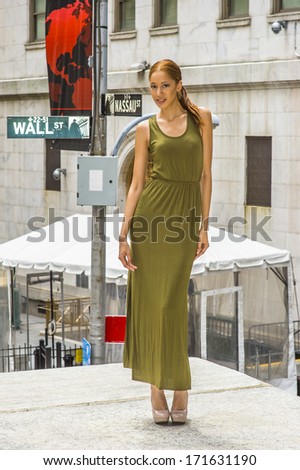 Dressing in a green Maxi Tank Dress, creamy high heels, a black girl is standing in the corner of streets, charmingly looking at you. Wall Street sign in the background. / Street Fashion