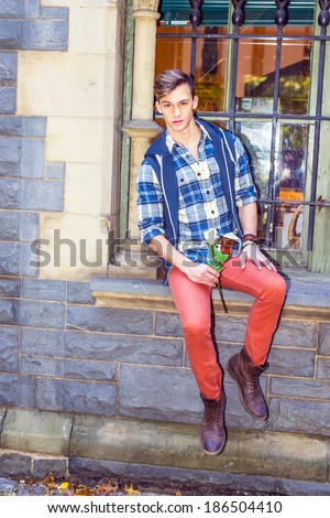 Young Man Waiting for You. Dressing in a pattern shirt,  a hood vest,  red jeans and brown leather boot shoes, a young guy is sitting by a window, holding a white flower, waiting for you.