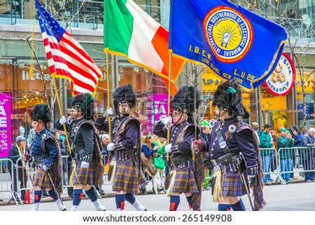 NEW YORK CITY - MARCH 17: Holding flags, sword, dressing in Irish costumes, a guard of honor marching in St. Patrickâ??s Day Parade on March 17, 2015 along Fifth Avenue in Manhattan, New York.