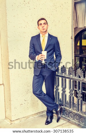 Businessman with little scar on lip - cleft lip, standing on balcony, holding coffee cup, looking up, thinking. Concept of facing reality, up and down, self assured, self esteem, confident and success
