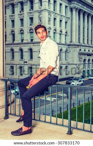 Businessman Working in New York. Wearing white shirt, black pants, leather shoes, a young college student sitting on railing in business district, thinking. Man Casual Fashion. Instagram effect.