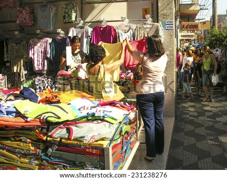 Sao Paulo, Brazil, March 10, 2007. People visit stores Jose Paulino street, on Bom Retiro district, in Sao Paulo Brazil. This street is famous for its shops selling clothes.