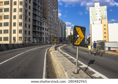 Sao Paulo, Brazil, June 09, 2013: People have fun in a high road, closed to cars on Sundays and holidays, in downtown Sao Paulo