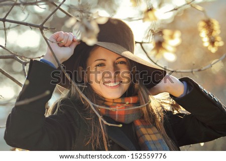 Autumn portrait of an happy girl with beautiful smile