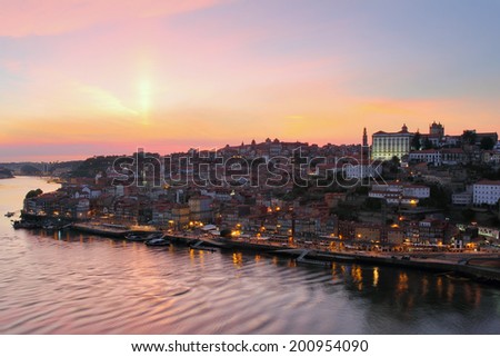 Beautiful Porto cityscape in sunset orange light .