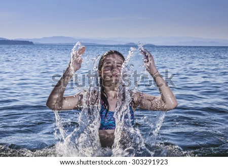 Girl watering your body with water in sea